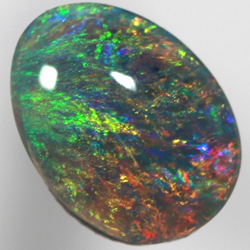 SOLID SEMI BLACK OPAL Pinfire pattern of orange green and blue